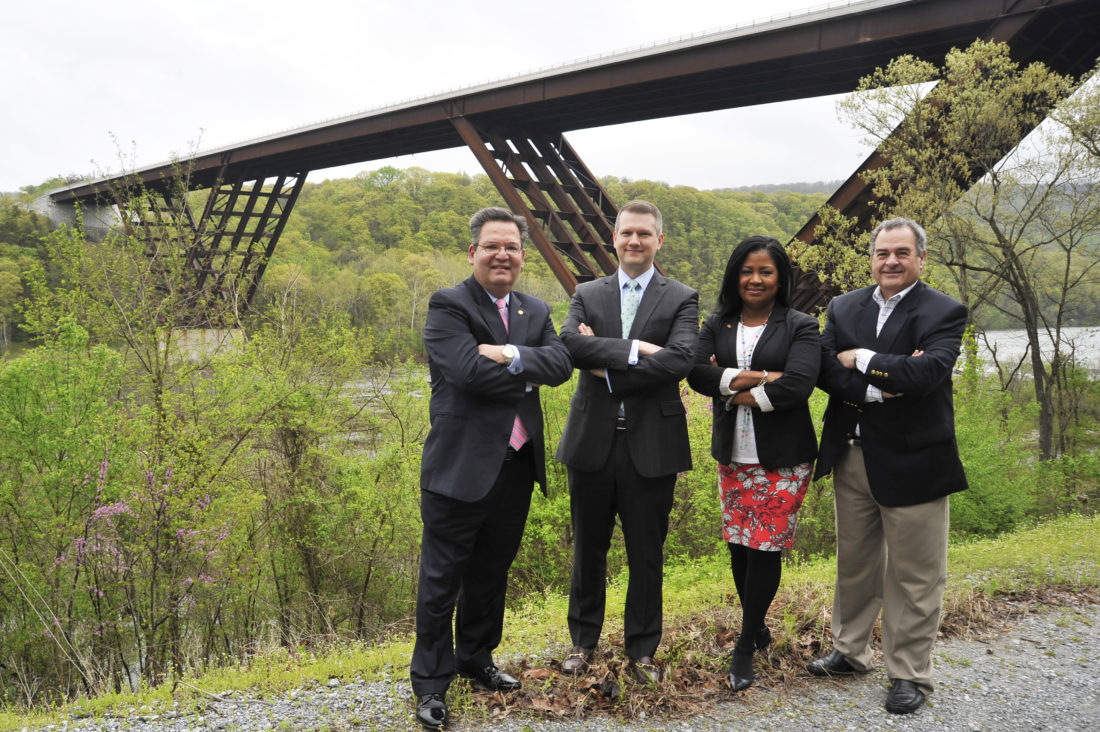Delegates Paul Espinosa, R-Jefferson; Riley Moore, R-Jefferson; Jill Upson, R-Jefferson; and Harpers Ferry resident Scot Faulkner proudly stand in front of the bridge they were successful in naming the “Major Martin Robison Delany Memorial Bridge” after the highest ranking African-American officer in the Civil War. (Journal photo Jeff McCoy)