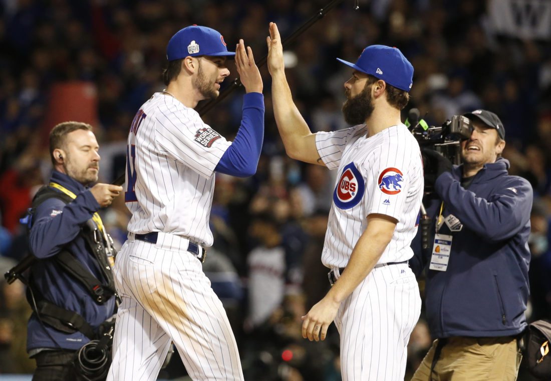 Chicago Cubs' Kris Bryant, left, celebrates with Jake Arrieta after Game 5 of the Major League Baseball World Series against the Cleveland Indians, Sunday, Oct. 30, 2016, in Chicago. The Cubs won 3-2 as the Indians lead the series 3-2. (AP Photo/Nam Y. Huh)