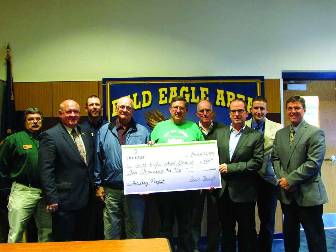 EMMA GOSALVEZ/THE EXPRESS
Domtar Paper Company, which is the largest North American manufacturer of uncoated paper, has committed $10,000 to support Bald Eagle Area School District in a collaborative forest management project. From left to right: Tim Cole, Centre County service forester for DCNR Bureau of Forestry; Rep. Glenn Thompson; Gerald Hoy, Mifflin and Union counties’ service forester for DCNR Bureau of Forestry; Tom Letterman, Bald Eagle Area School District board member; Mark Ott of Pennsylvania Forestry Association; Jim Finley of Penn State’s Center for Private Forests; Grant Forrest, general manager of Domtar Paper Company; Mike Eckley, forester for The Nature Conservancy; and Jeff Miles, Bald Eagle Area School District superintendent.