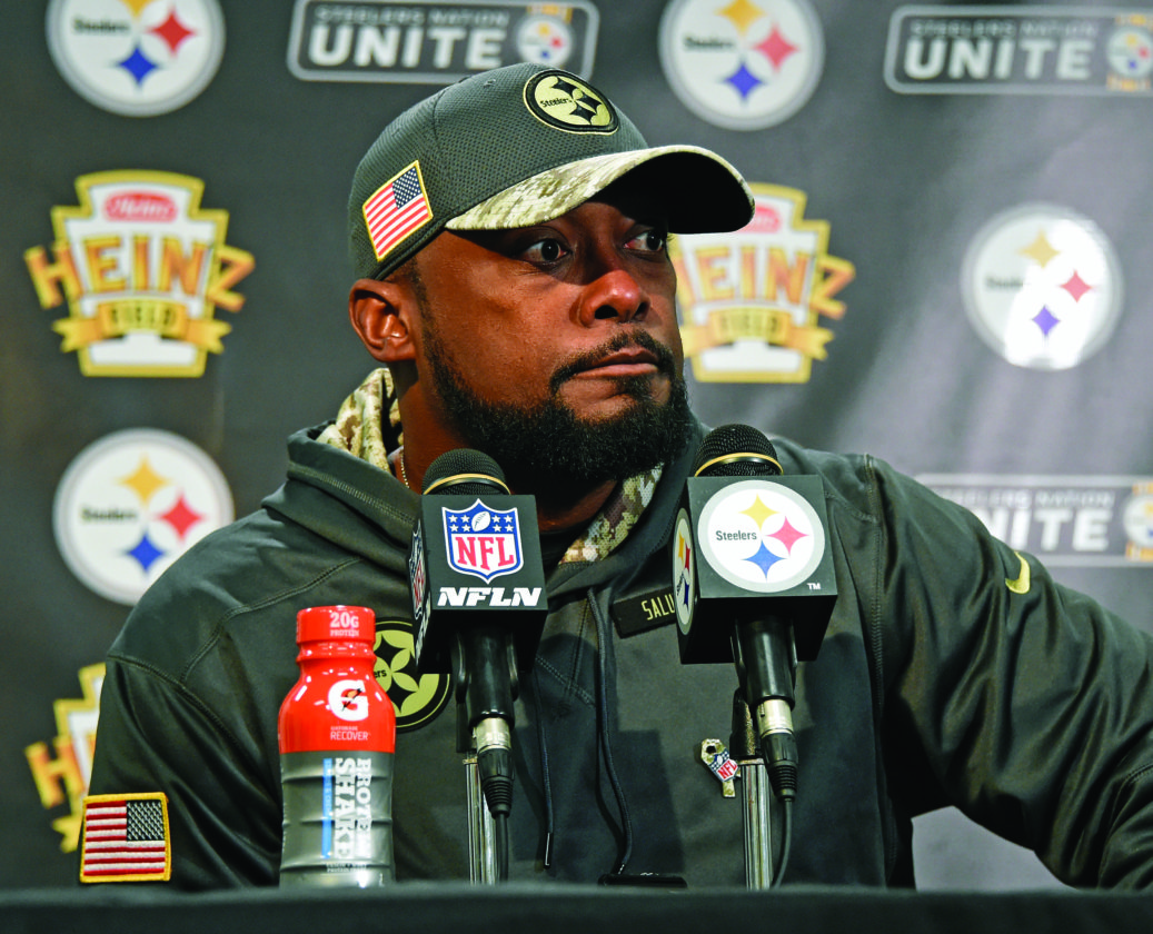 Pittsburgh Steelers head coach Mike Tomlin listens to a reporter's question after an NFL football game between the Steelers and the Dallas Cowboys in Pittsburgh, Sunday, Nov. 13, 2016. The Cowboys won 35-30. (Photo/Fred Vuich)