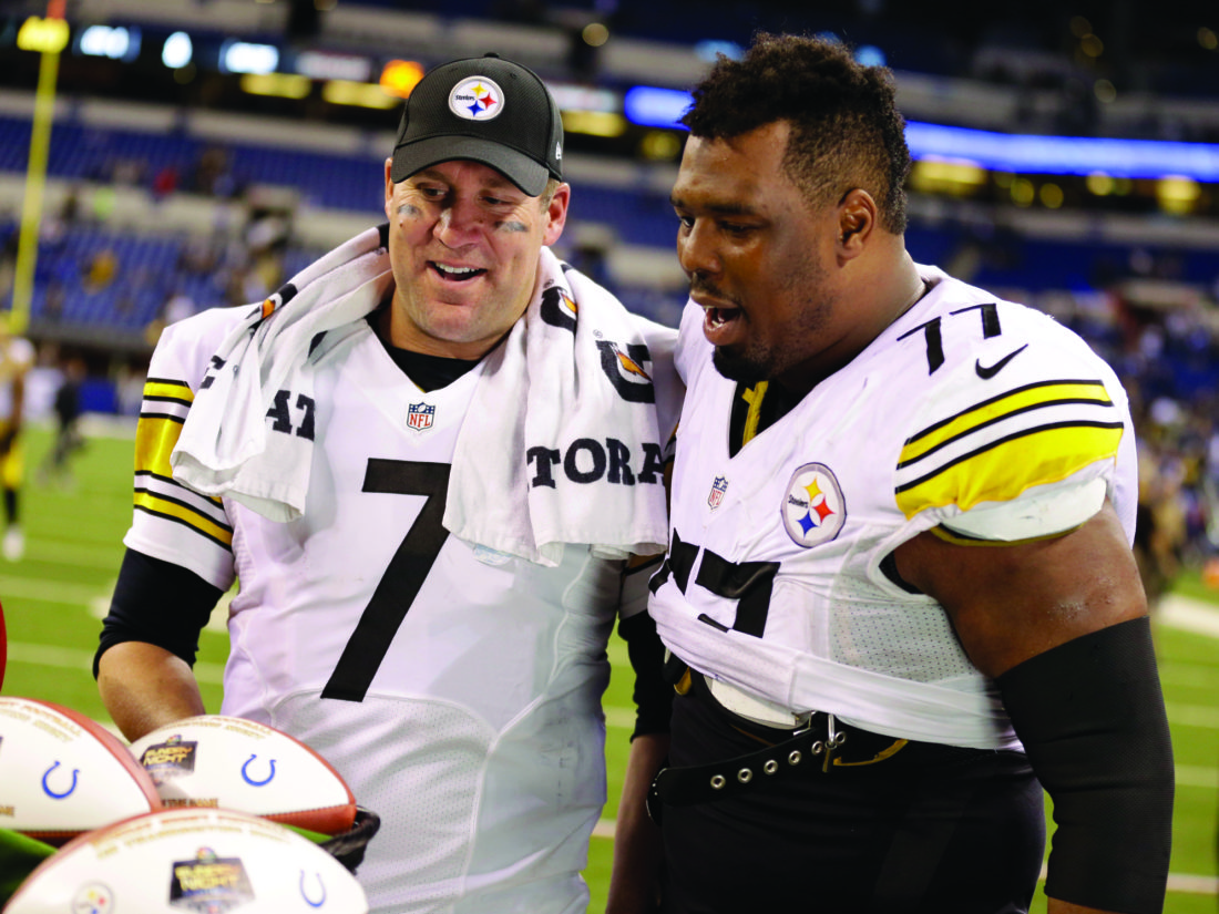 Pittsburgh Steelers quarterback Ben Roethlisberger, left, celebrates with teammate offensive tackle Marcus Gilbert after defeating Indianapolis Colts in an NFL football game Thursday, Nov. 24, 2016, in Indianapolis. Pittsburgh won the game 28-7. (AP Photo/Michael Conroy)