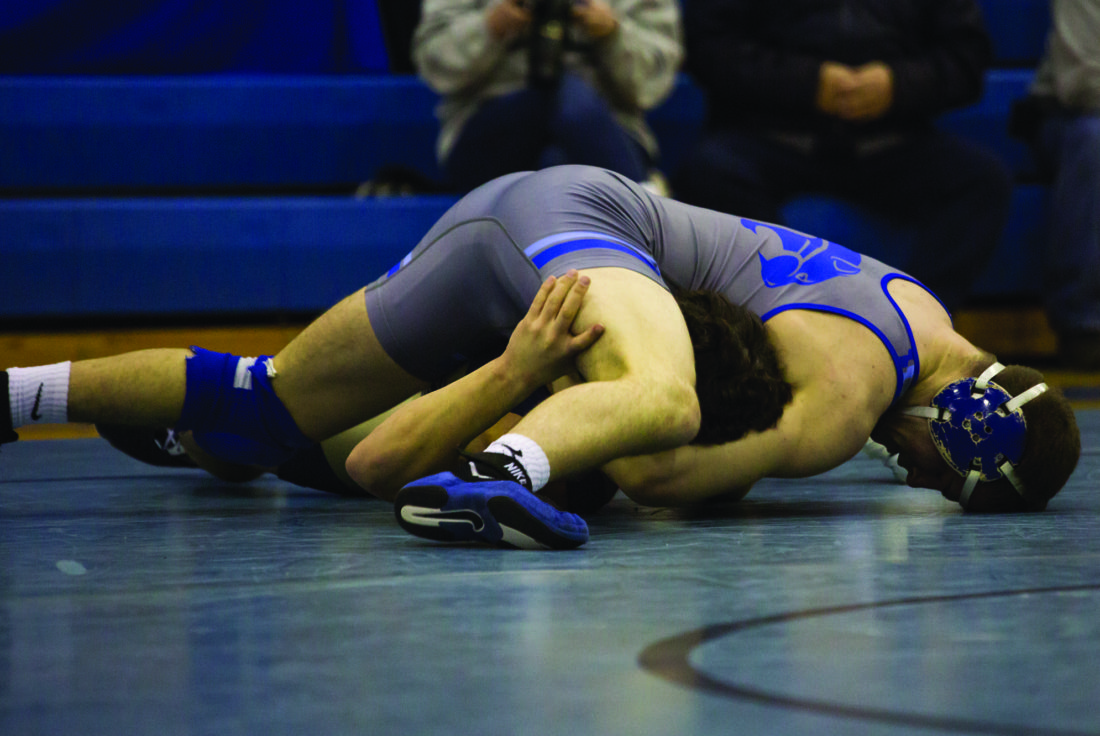 Brandon Miller (top center) wrestles his opponent from Hollidaysburg High School. Central Mountain won their senior night, 53-13. (The Express/Spencer McCoy)
