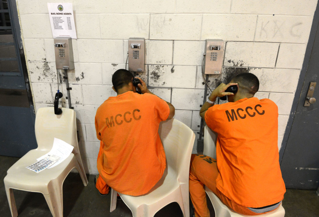 Maui Community Correctional Center inmates make telephone calls from their cellblock on Tuesday.
The Maui News / MATTHEW THAYER photo