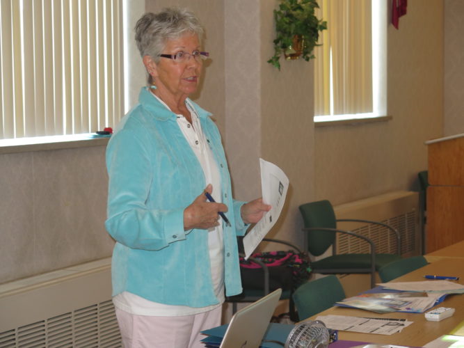 Photo by Betsy Bethel Janet Kowalski presents a child sexual abuse lecture during a recent crisis hotline volunteer training.