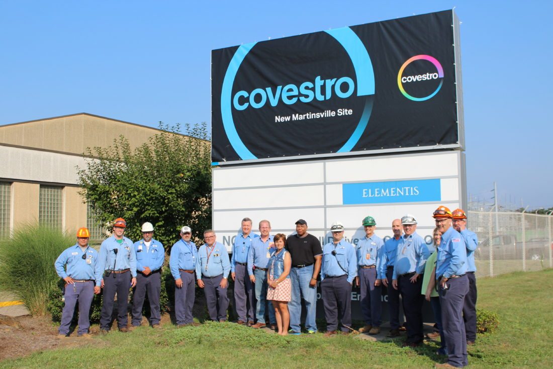 Photo Provided
Covestro employees gather in front of the plant’s sign.