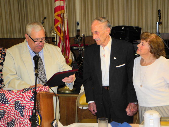 Photo by Warren Scott
Paul “Bud” Billiard of the Brooke County Veterans Memorial Park Foundation, presents the group’s Veteran of the Year award to Anthony Paesano as Paesano’s wife of 66 years, Lorraine, looks on.